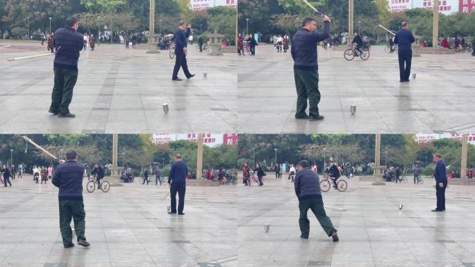 广场市民散步打陀螺健身