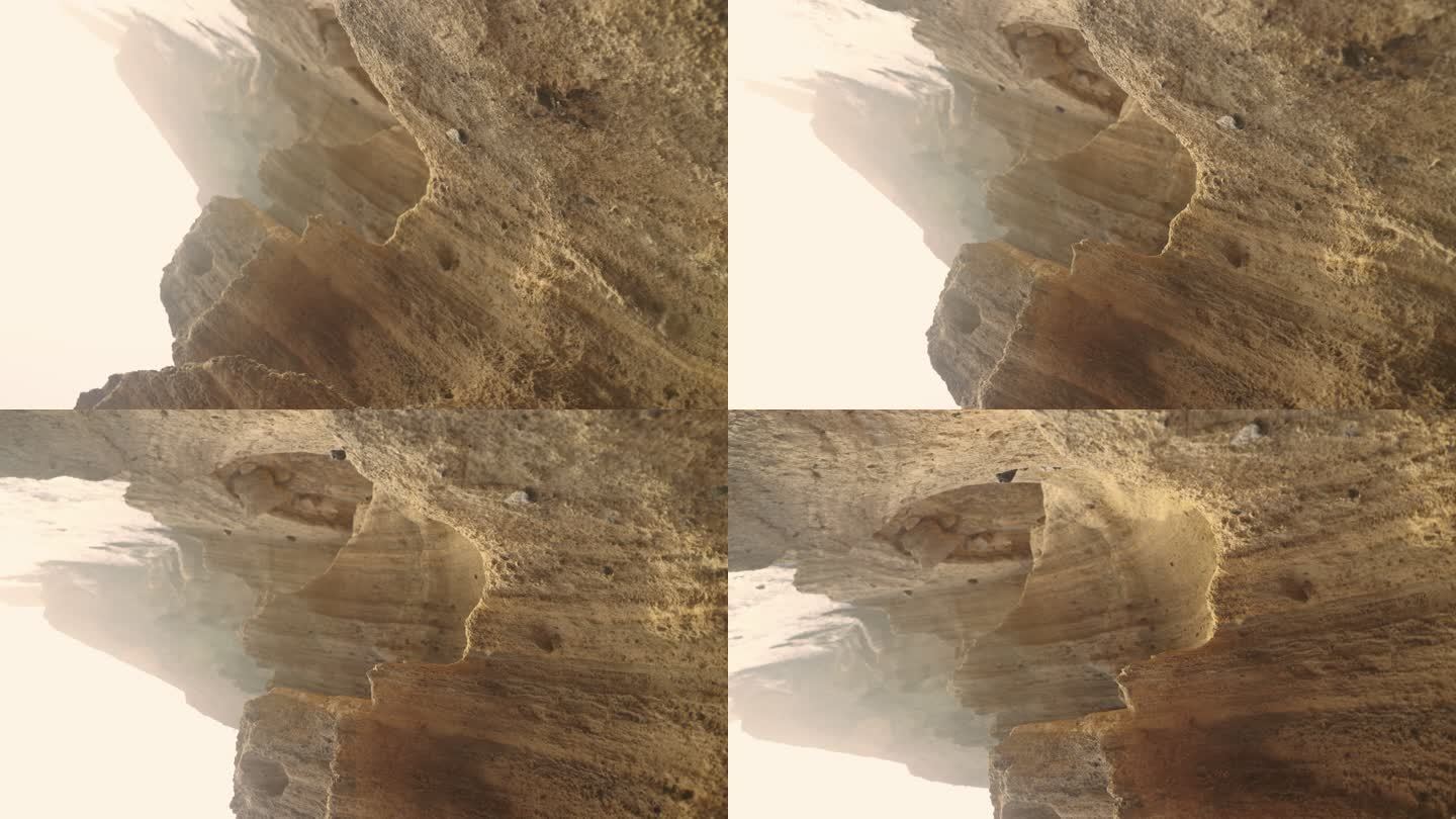 干旱气候中干燥的红色峡谷。相机在陡峭的层状岩石上旋转