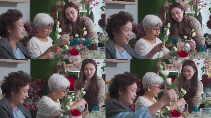亚洲华人女花艺师在花店教成年学生插花