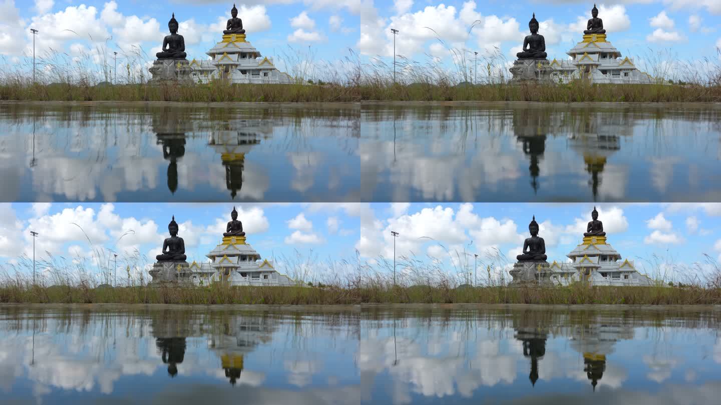 泰国宋赫拉省Phutthamonthon区的Bhuda雕像与水的倒影