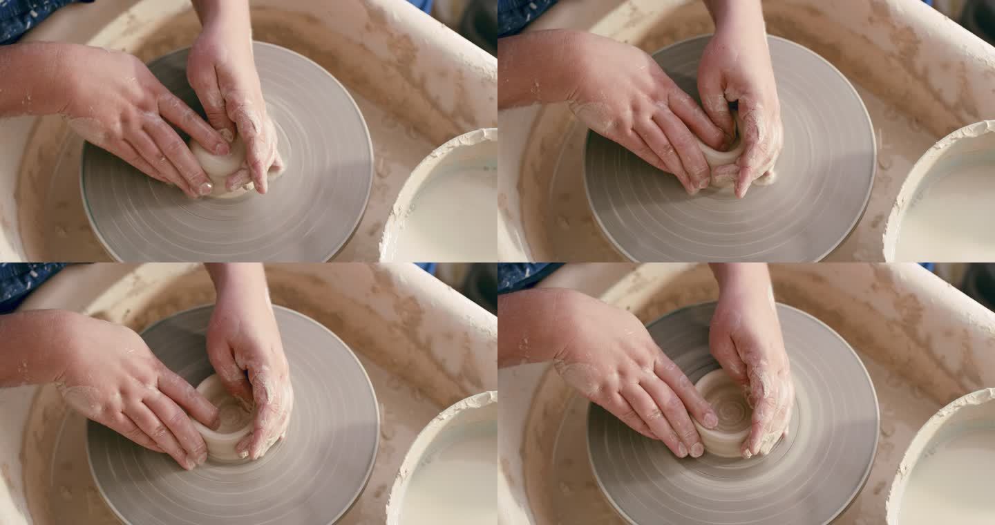 陶器课上塑造陶罐的双手特写。上图是一尊享受他最喜爱爱好的雕塑。放大技术娴熟的艺术家柔软、棕色、凌乱的