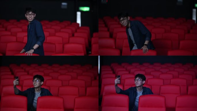亚洲中国年轻人用智能手机自拍，一边在电影院等待电影放映时间，一边在社交媒体上发布自己的照片