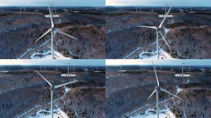 风力涡轮机鸟瞰图冬天大雪覆盖山林风力发电