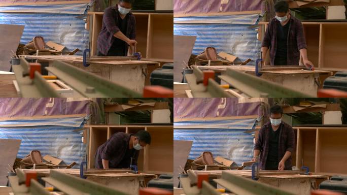 一个在自己的木工店当木匠的人。小型企业