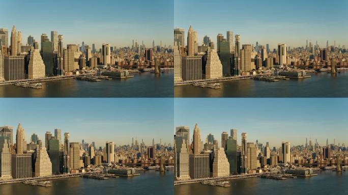 清晨，黎明时分，曼哈顿市中心海滨的鸟瞰图。具有平移相机运动的无人机视频