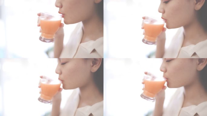 喝橙汁少女人喝果汁健康生活