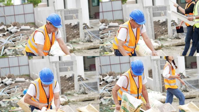 几位土木工程师在后台工作，一位年长的土木工程师正在搬运一袋水泥。