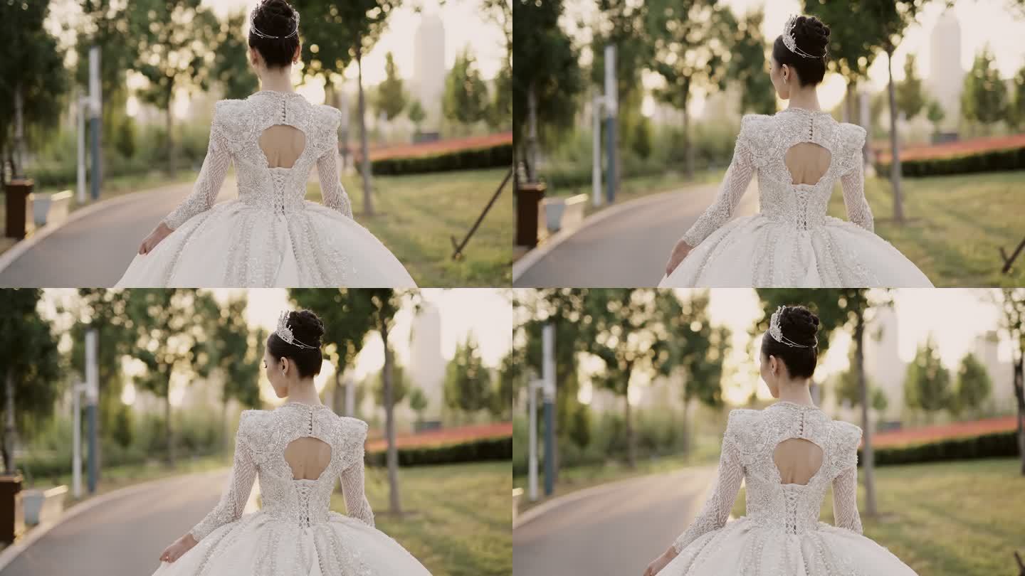 年轻漂亮的亚洲新娘穿着白色婚纱，在花园里散步，从背后拍摄，慢镜头