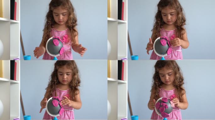 学龄前女孩在家玩儿童游戏粘土的视频