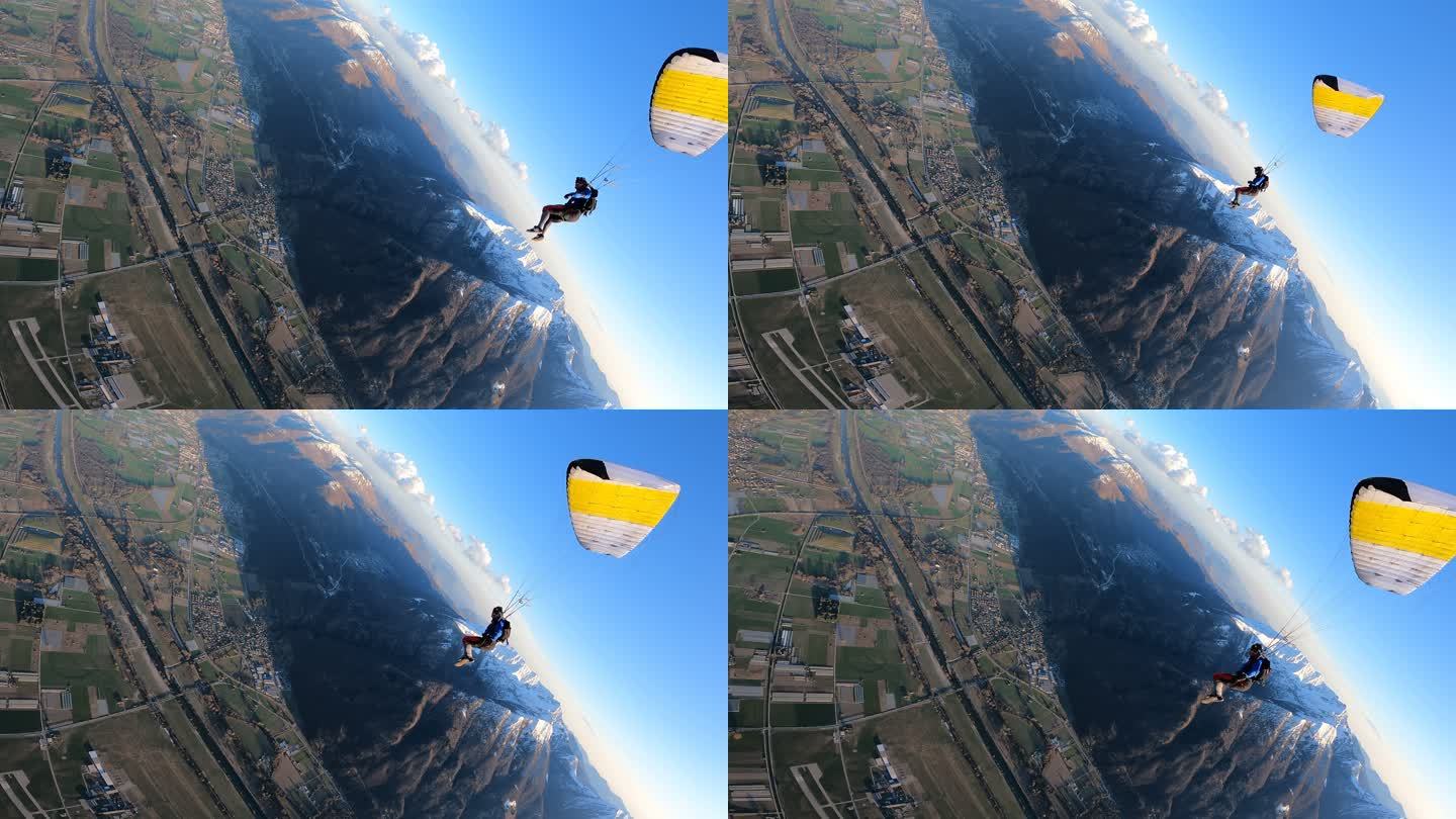 跳伞者穿过乡村景观上空的晴空而下