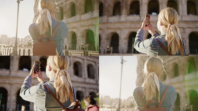 女游客用手机拍摄罗马著名的斗兽场