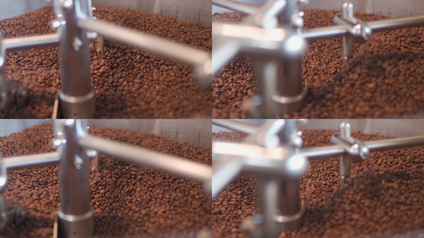 咖啡烘焙机旋转冷却过程在大型工业烘焙机中烘焙一批高质量单一来源咖啡豆的过程；烤豆正在冷却循环中。