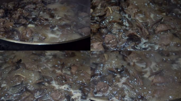 小鸡炖蘑菇 灶台上的铁锅炖菜