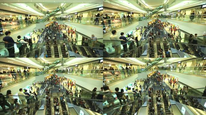 高清：在商场的自动扶梯上行走的人群。