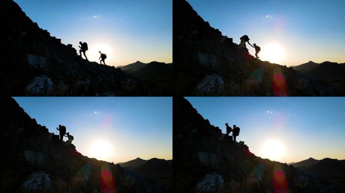 团队登山剪影手拉手爬山团队合作成功登顶