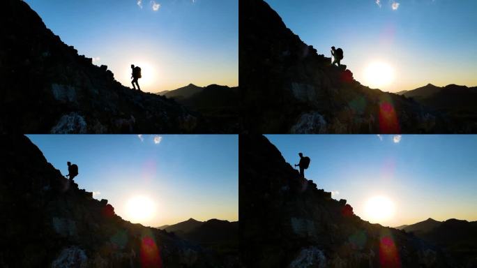 男人逆光登山剪影登山行者攀登顶峰爬山视频
