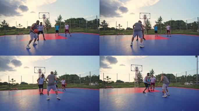 朋友在户外打篮球跳投过人假动作