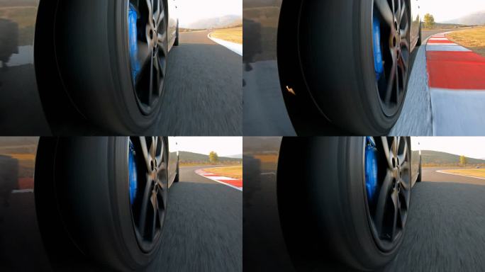 赛车赛事中追逐比赛时跑车车轮旋转的特写镜头