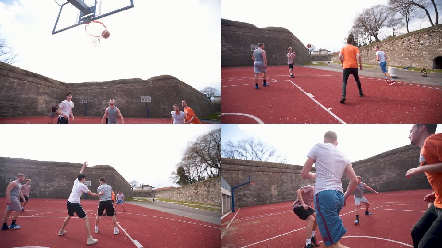 一群朋友在室外球场上打篮球