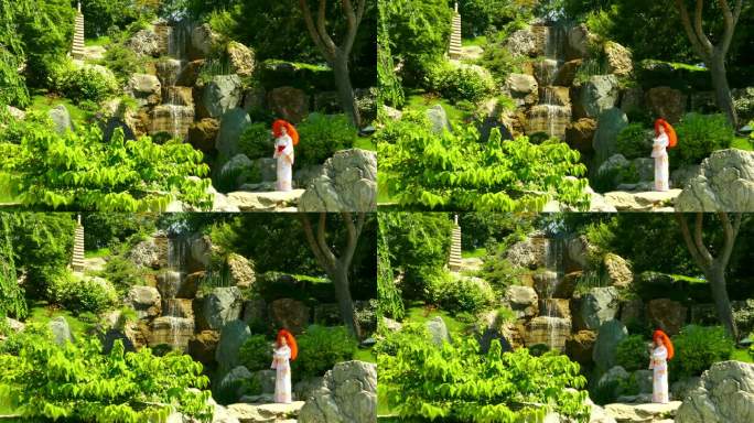 瀑布附近的日本花园和和服女人