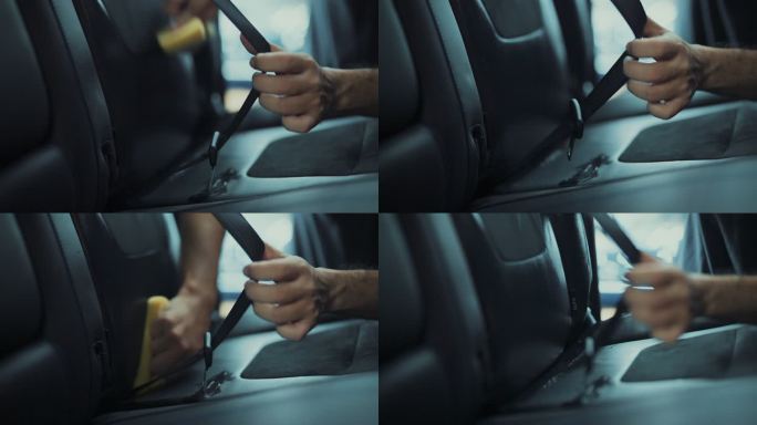 汽车细节服务在汽车细节清洁服务期间，一名年轻男子在清洁座椅内饰时使用细布进行深层内部清洁。