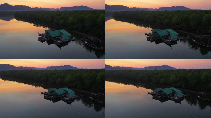 泰国萨顿省红树林福雷斯特运河和渔村的空中无人机日出场景
