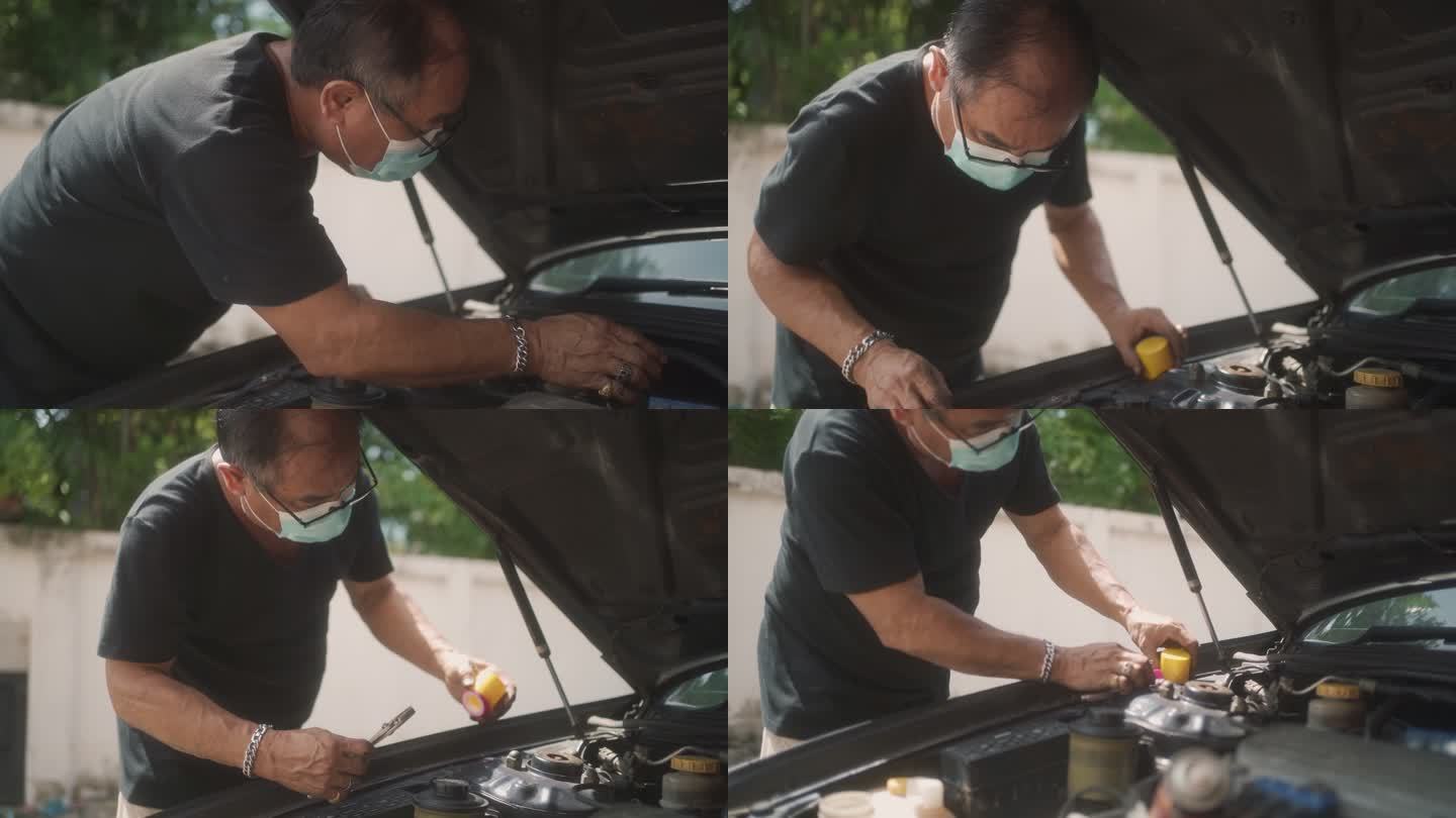 修理汽车的高级男子。