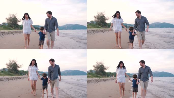 海滩上的家庭活动父母带孩子牵手幸福一家人