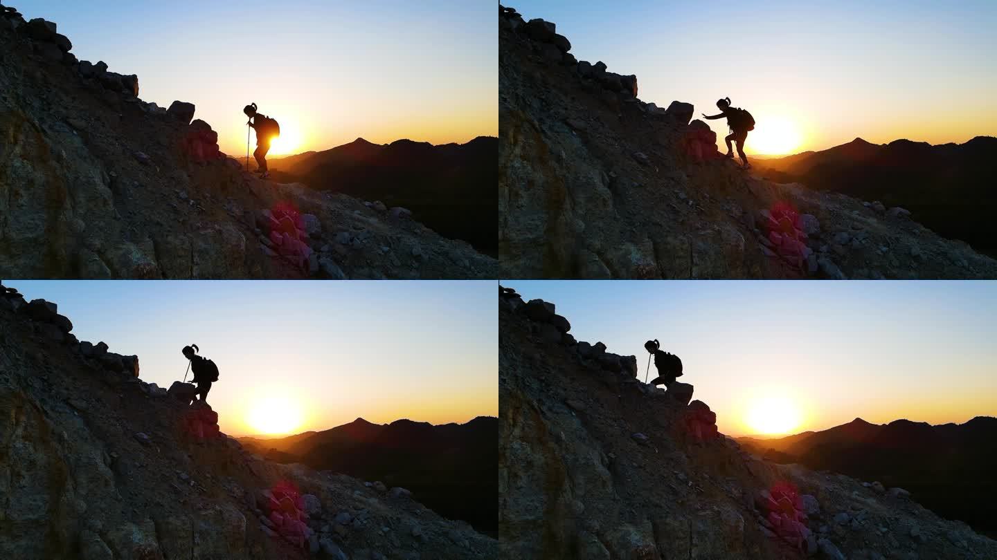 女生登山剪影挑战自己攀登顶峰登山精神爬山