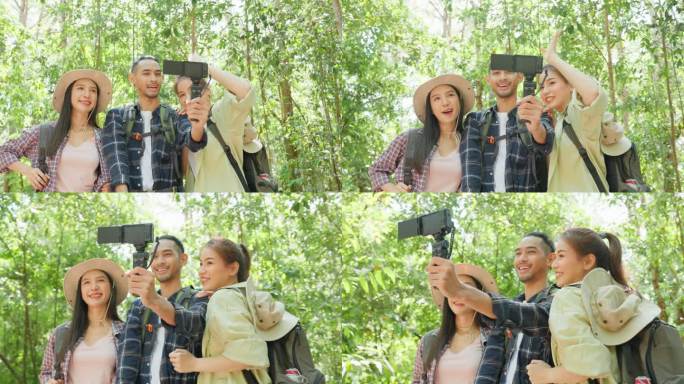 一群亚洲背包客独自在森林里旅行。有吸引力的朋友旅行者使用手机录制视频视频，在假期旅行中快乐地漫步在自