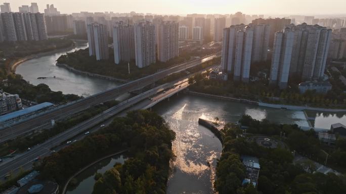 航拍成都城市风光河畔公园日落交通车流