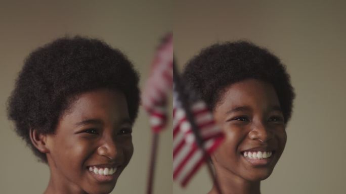 非洲男孩挥舞美国国旗