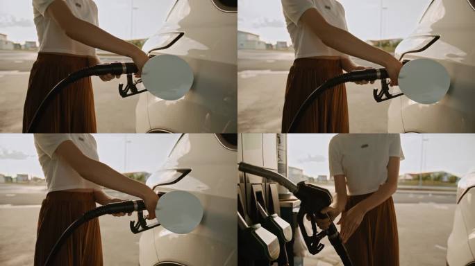 SLO MO无法辨认的女子正在给她的汽车加油