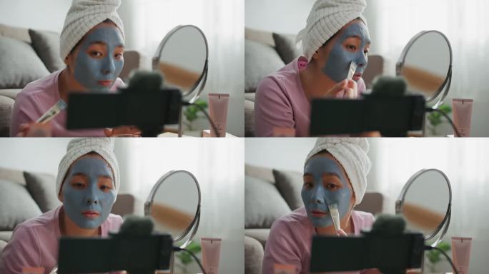 Youtuber博主在家里用化妆化妆品录制vlog视频在社交媒体上引起网络影响