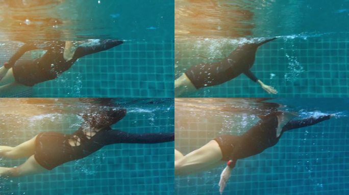 在海景下，在酒店游泳池中游泳的女性动作缓慢。