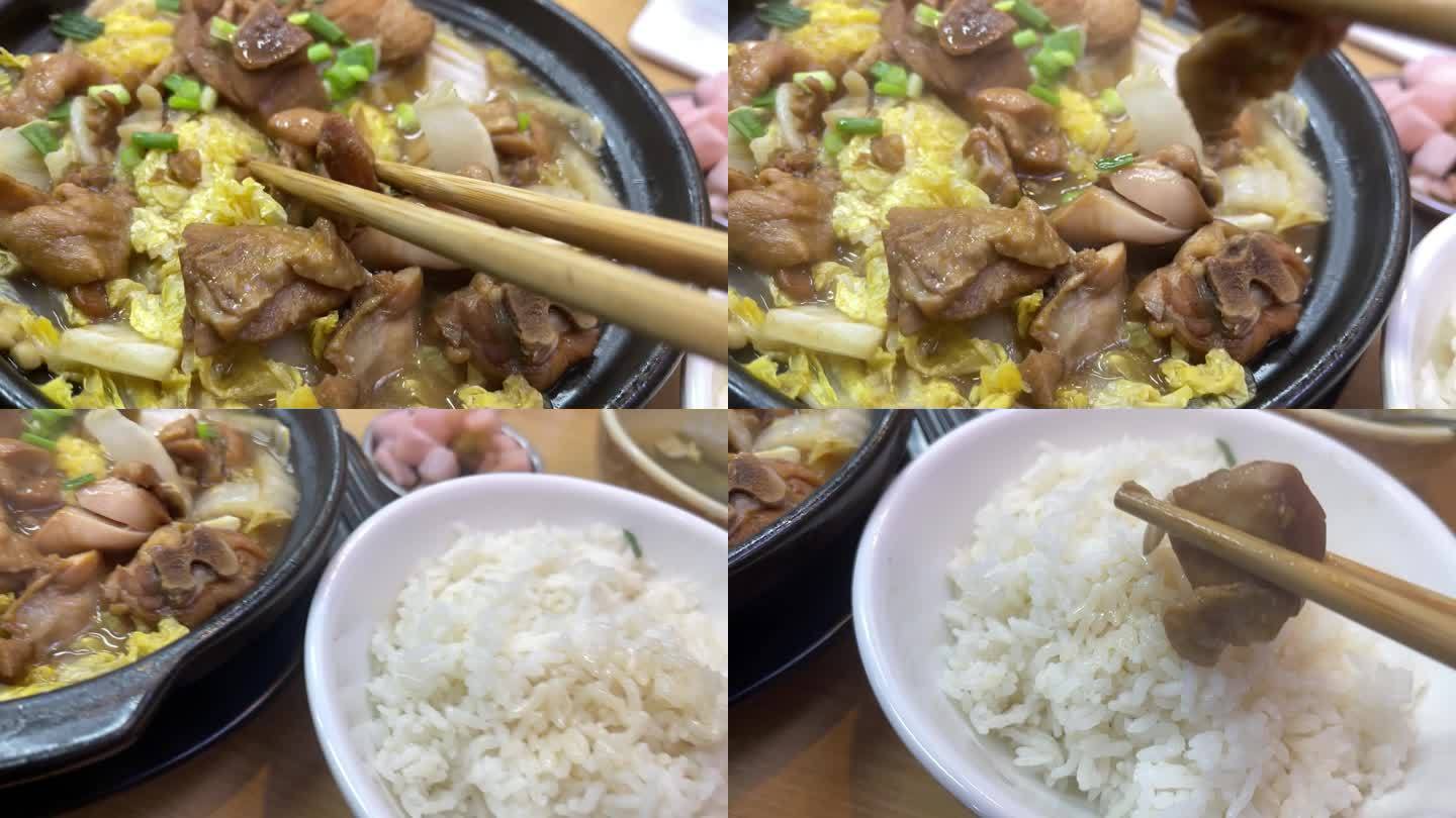 筷子夹黄焖鸡鸡块放米饭上慢动作