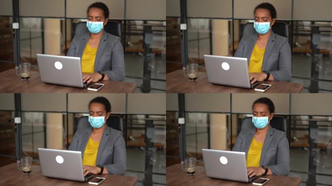 新冠肺炎疫情期间，女商人在办公室戴着防护口罩