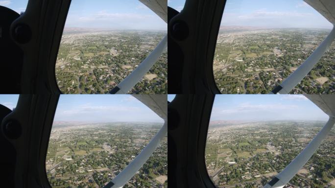 乘坐小型单引擎飞机飞越科罗拉多州一个乡村小镇时的景色