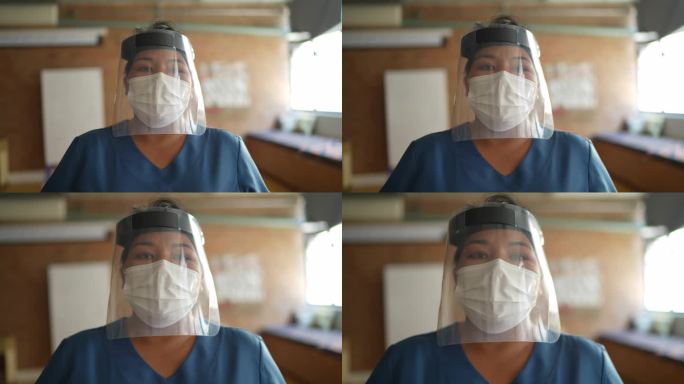 一名护士在医疗诊所使用面罩和面罩的肖像