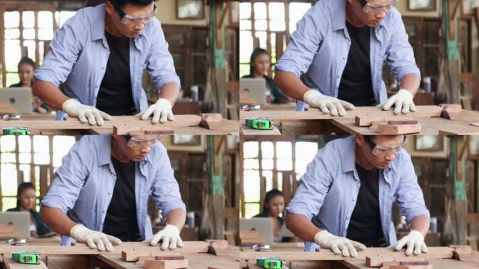 小企业主木匠用圆锯锯木头。