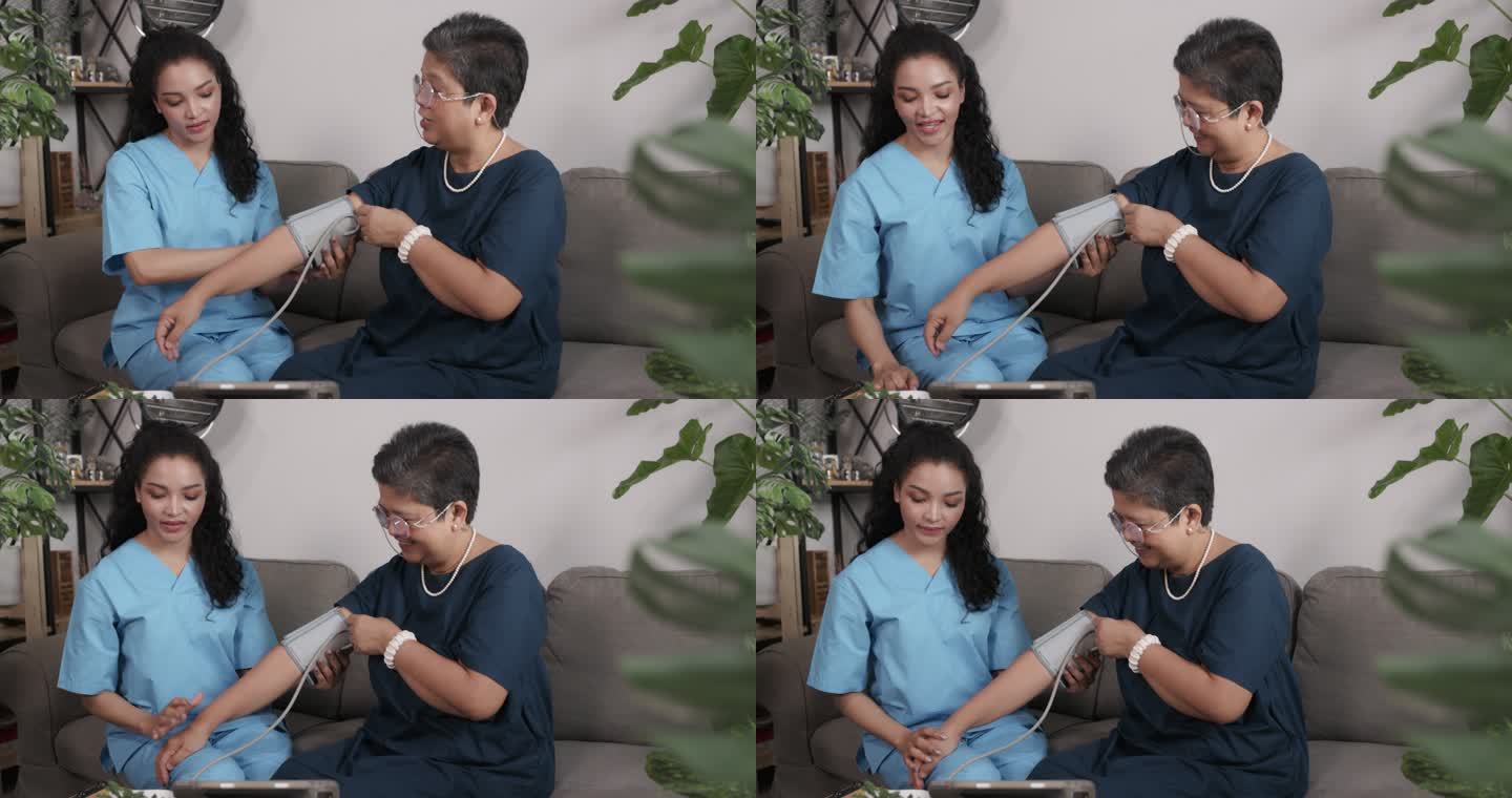护士在家里的客厅里给一位亚洲老人使用血压监测仪。在家中提供医疗保健服务。护理老年患者。个人护理业务。