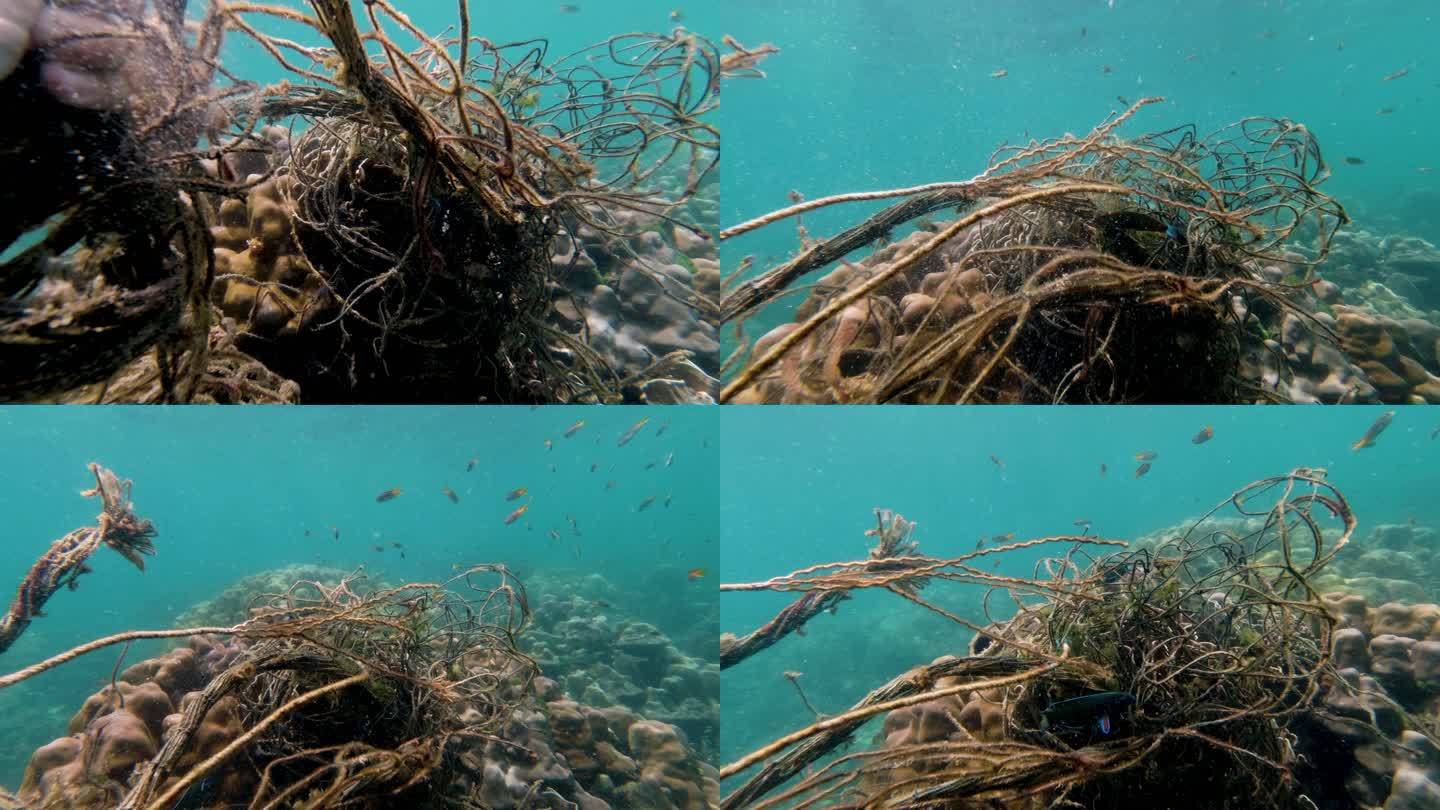 女水肺潜水员从海洋水下环保主义者那里清除幽灵网捕鱼污染