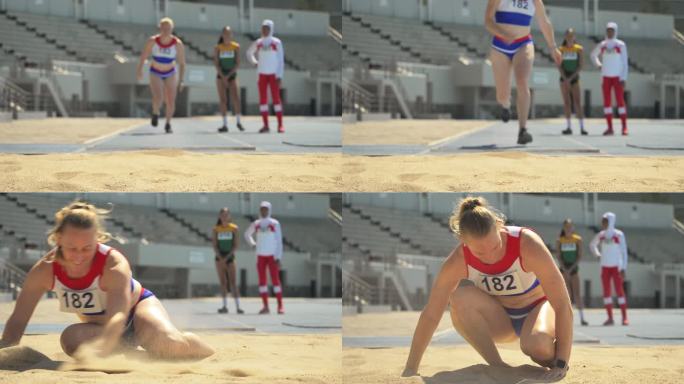 女子田径运动员沙滩跳远