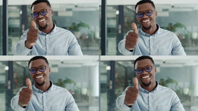 一个快乐而自信的年轻非洲裔美国商人在现代化的办公室里竖起大拇指。一位面带微笑的商人的肖像，露出满意的