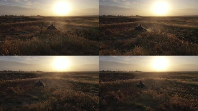 夕阳下农民驾驶拖拉机进行荒地开垦