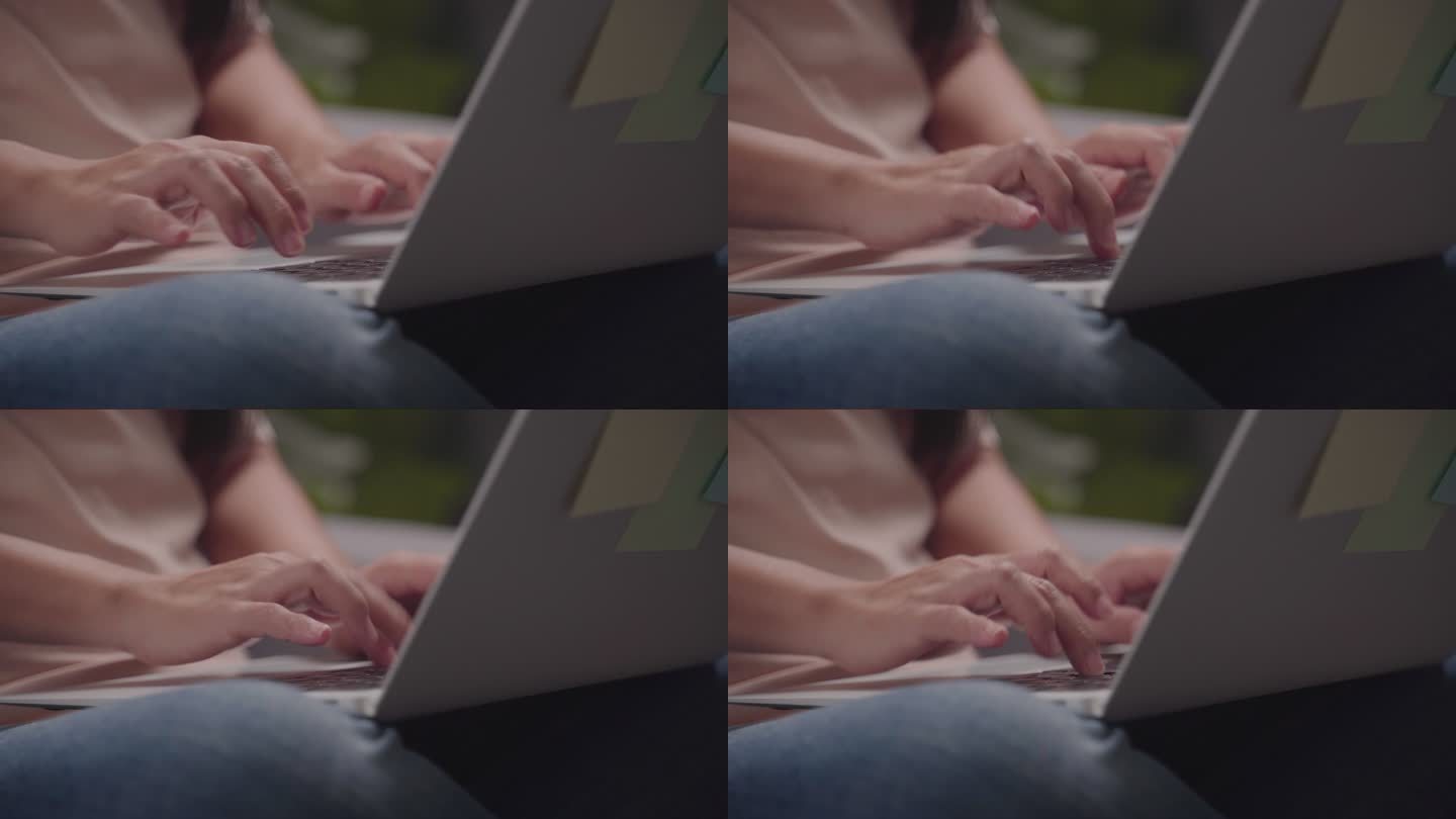 使用笔记本电脑的女性手的特写镜头。