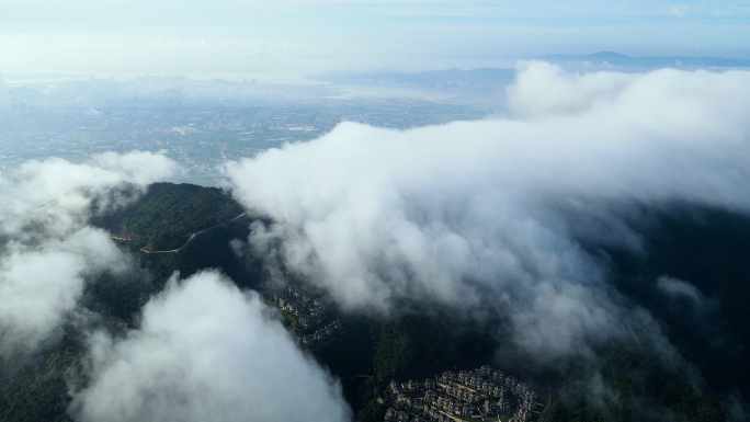 云雾云海下的山边小区楼盘4K航拍