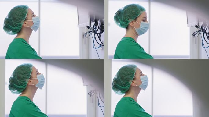 一名女眼科医生在手术室内看电脑屏幕的特写镜头