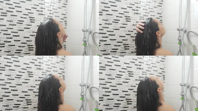年轻女子在浴室里淋浴和洗头