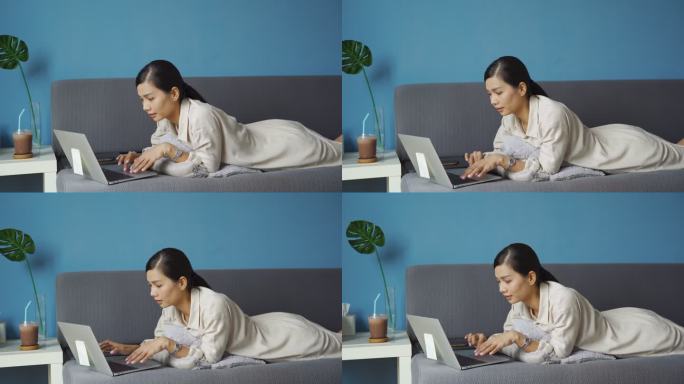 亚洲女性使用笔记本电脑